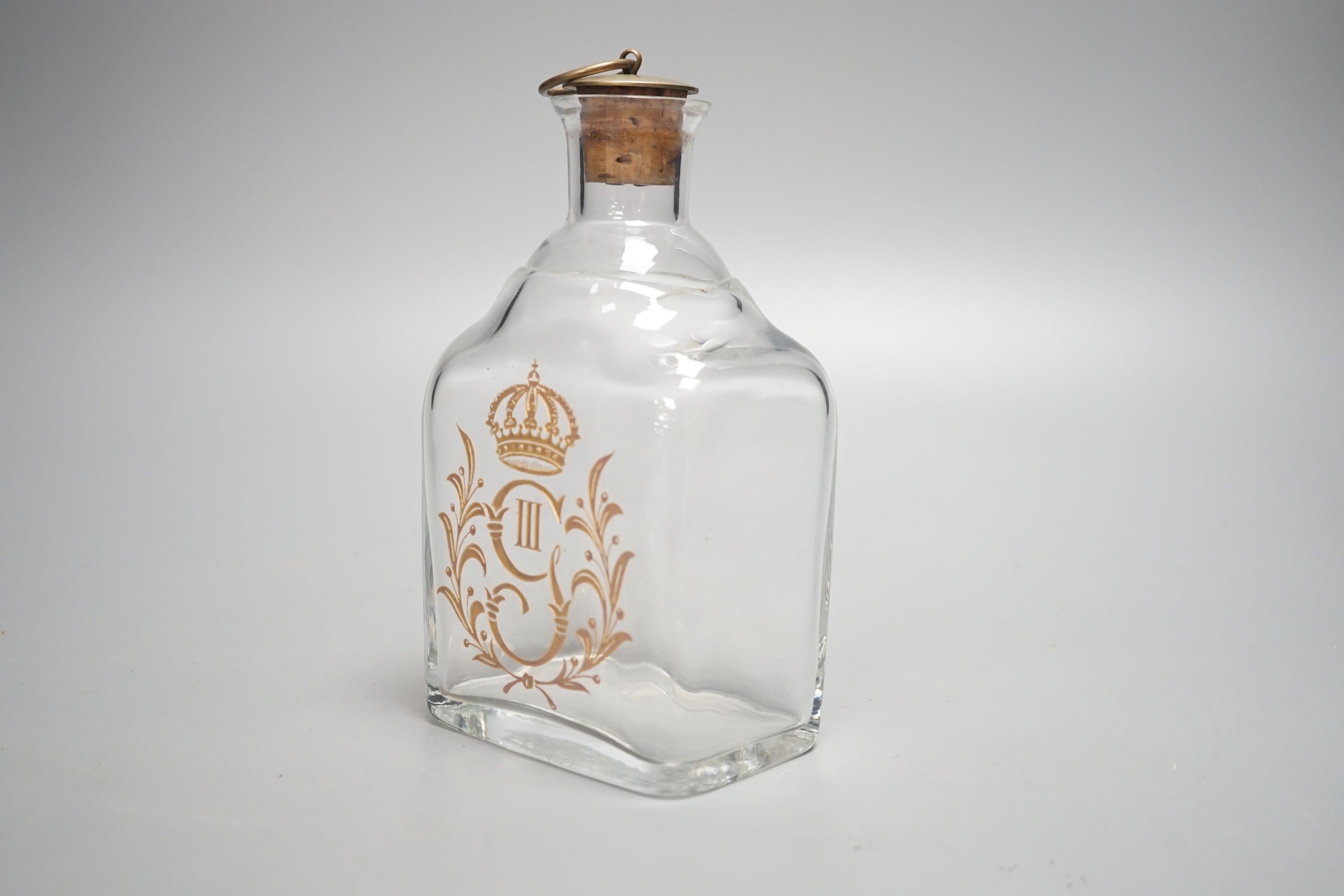 A 19th century crested glass decanter 17cm